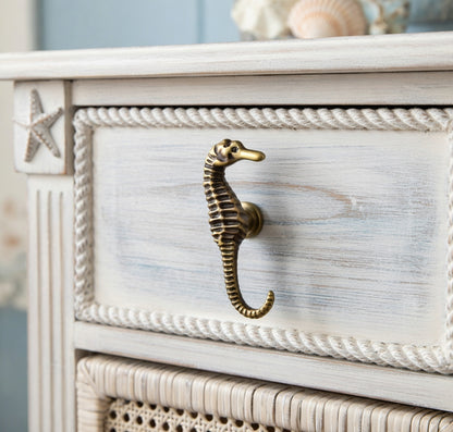 White dresser with seahorse handle and starfish design