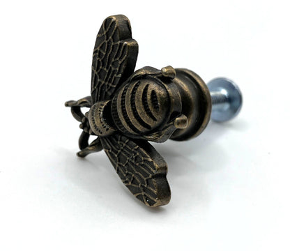 Bronze bee-shaped knob on a white background