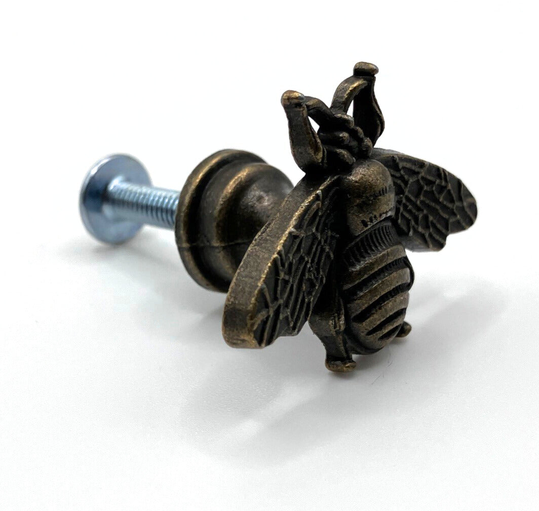 Bronze bee-shaped drawer pull on a white background