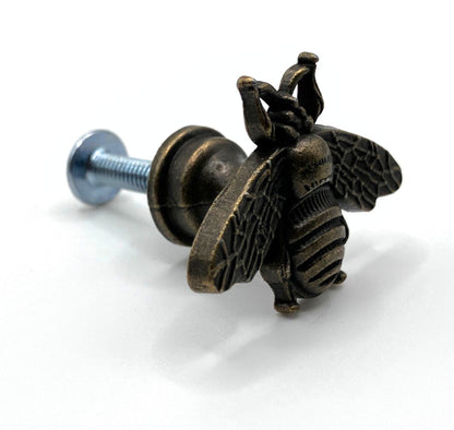 Bronze bee-shaped drawer pull on a white background