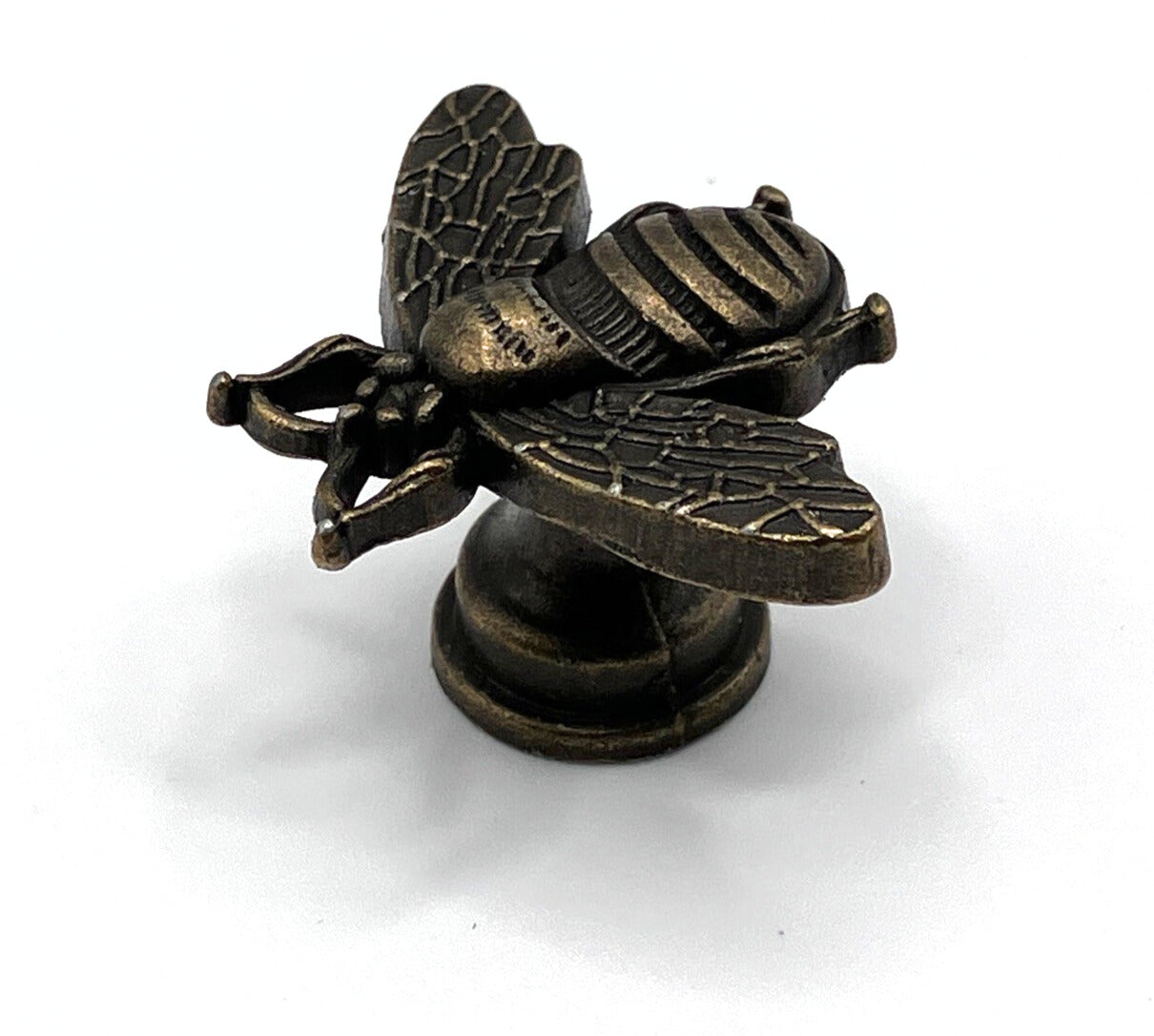 Bronze bee-shaped knob on a white background
