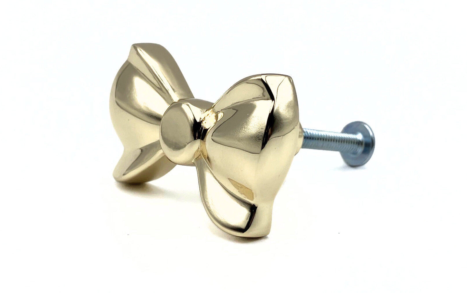 Brass gold button bow knob on a white background