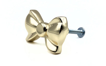 Brass gold button bow knob on a white background