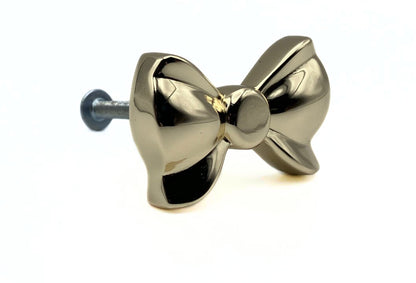 Brass gold button bow knob on a white background