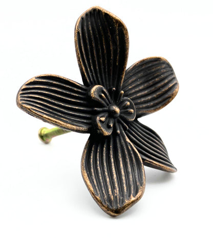Bronze flower-shaped decorative knob on a white background