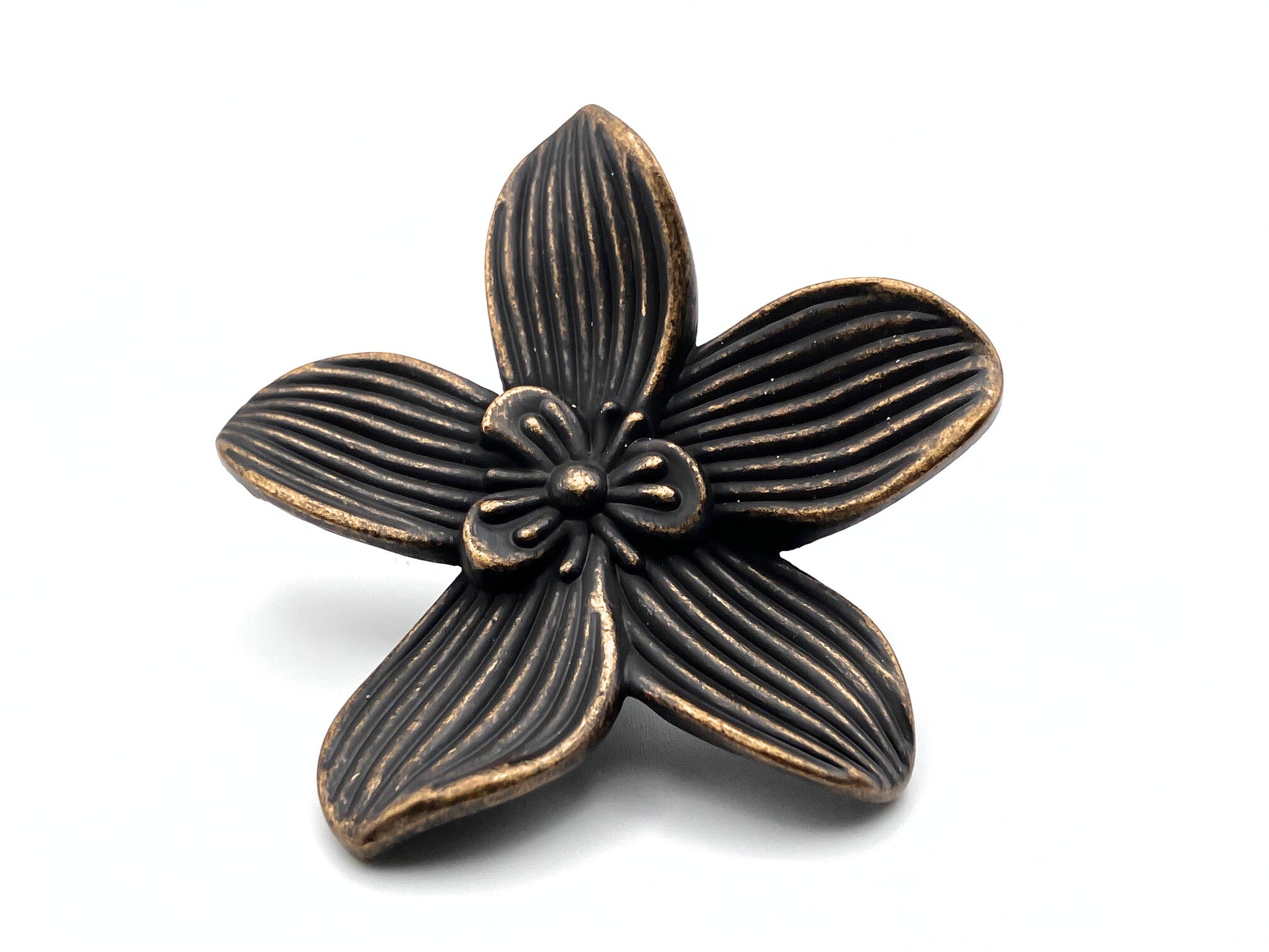 Bronze flower-shaped decorative knob on a white background
