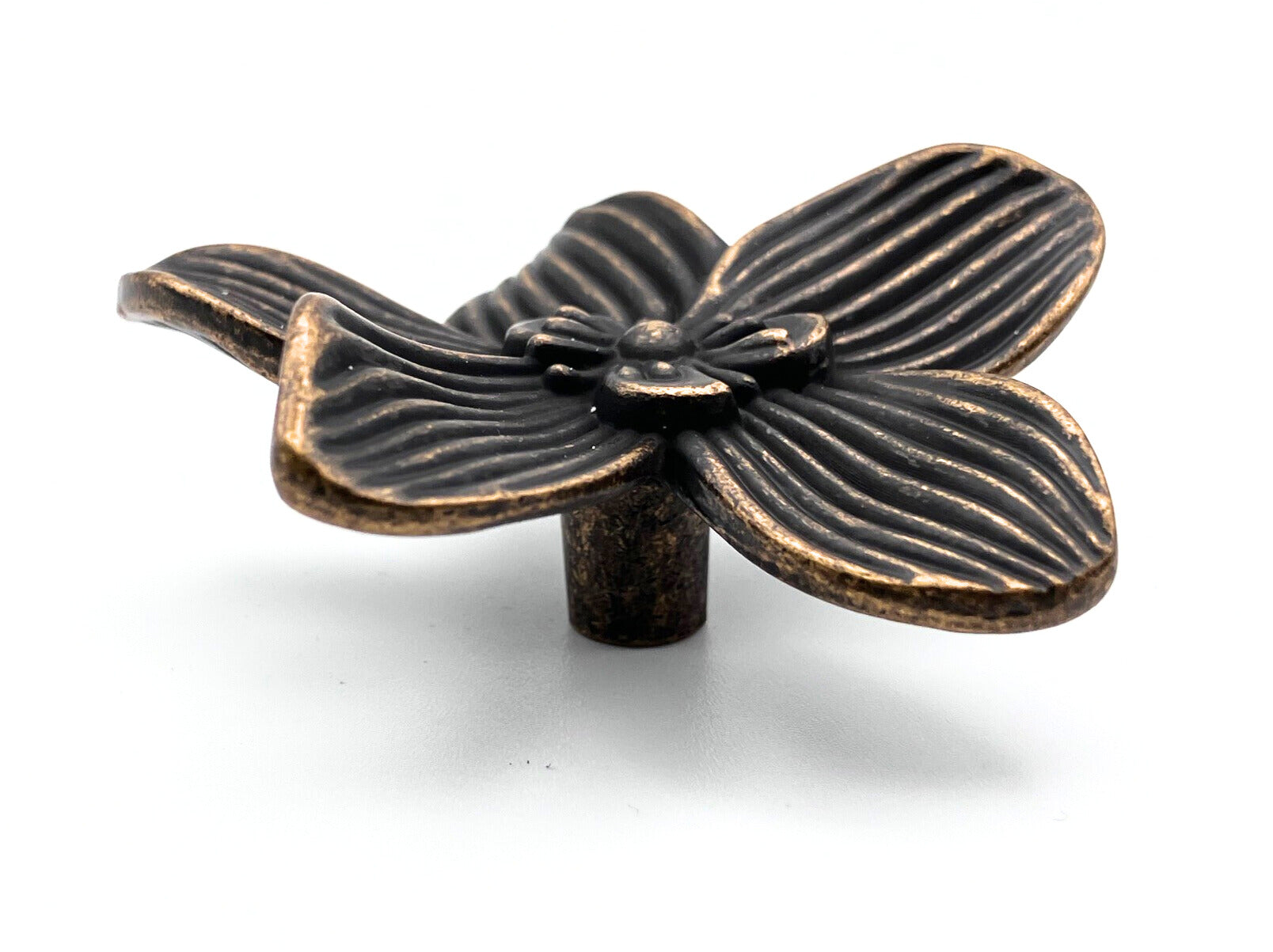 Bronze flower-shaped knob on a white background