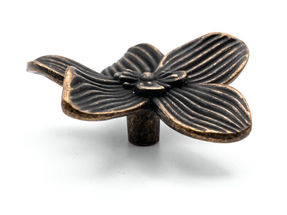 Bronze flower-shaped knob on a white background