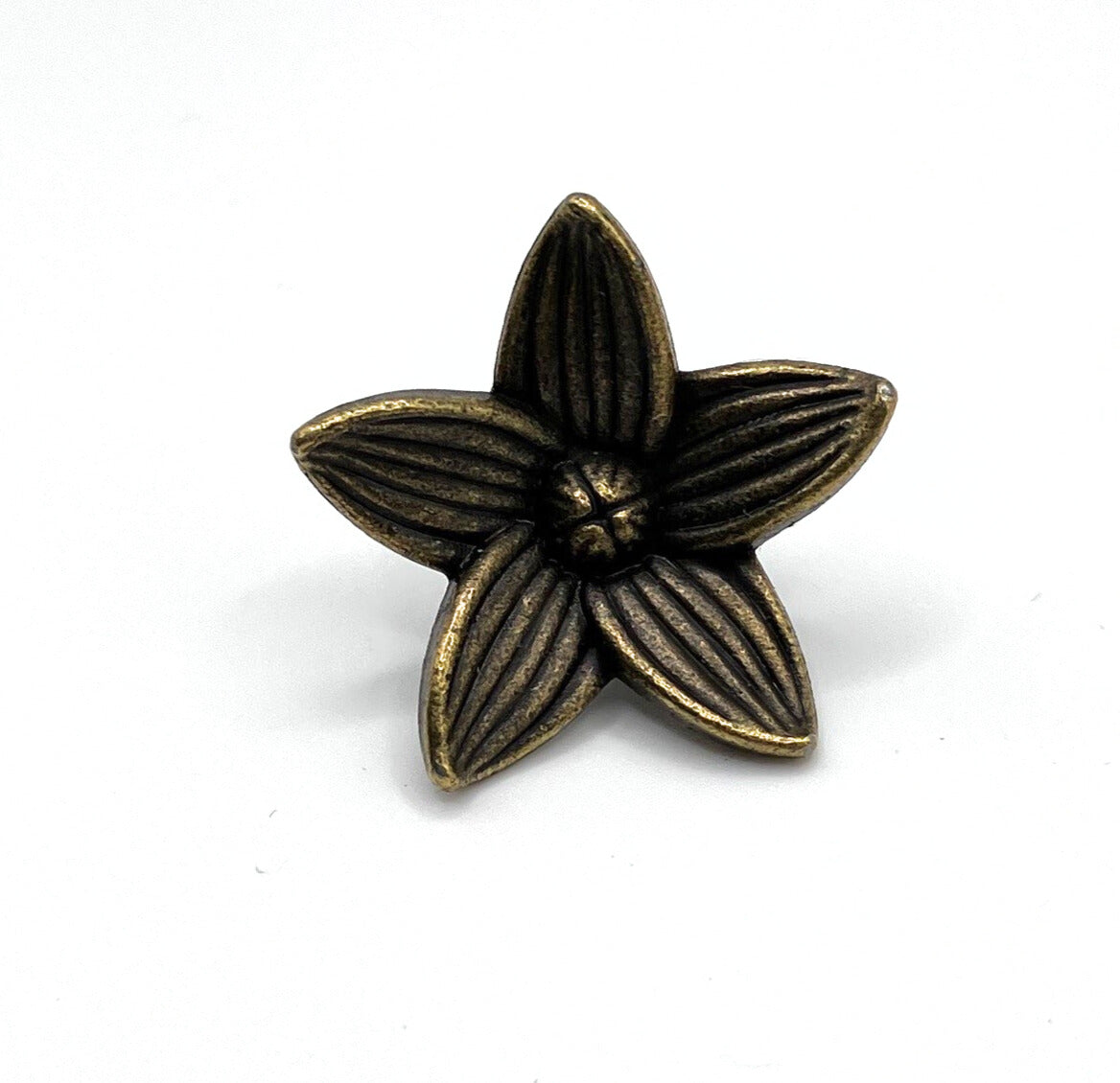 Bronze-colored flower-shaped knob on a white background