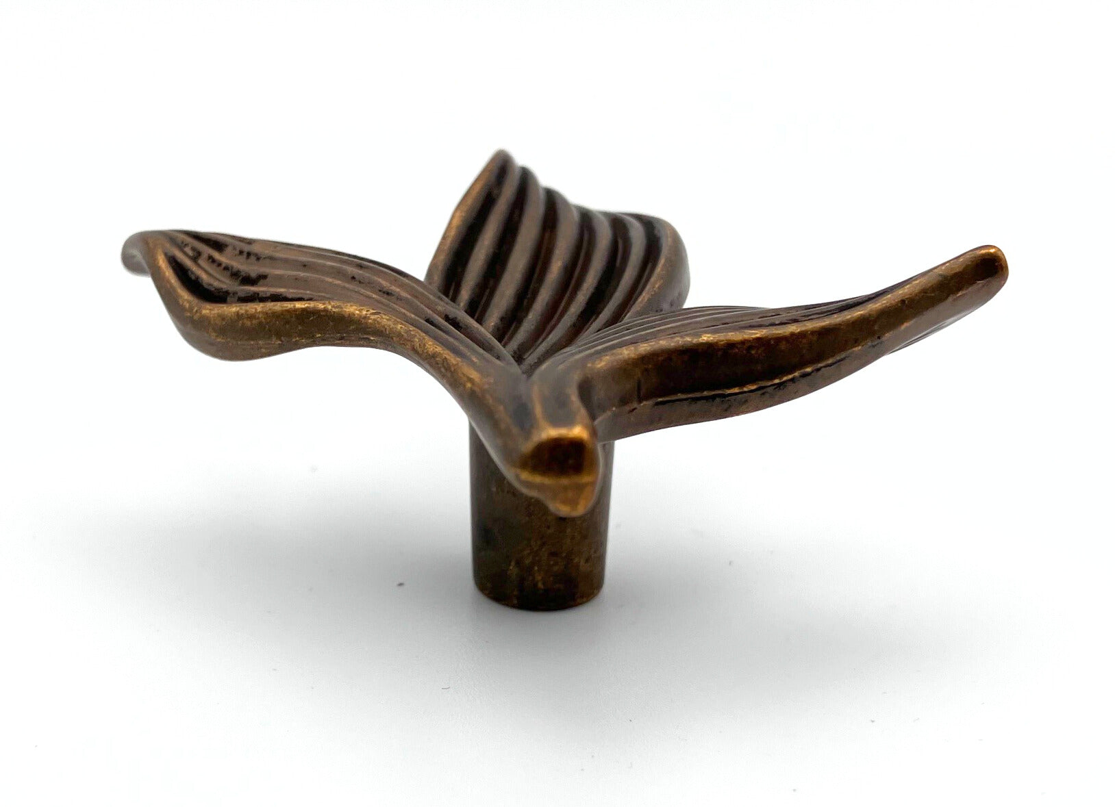 Bronze leaf-shaped cabinet knob on a white background