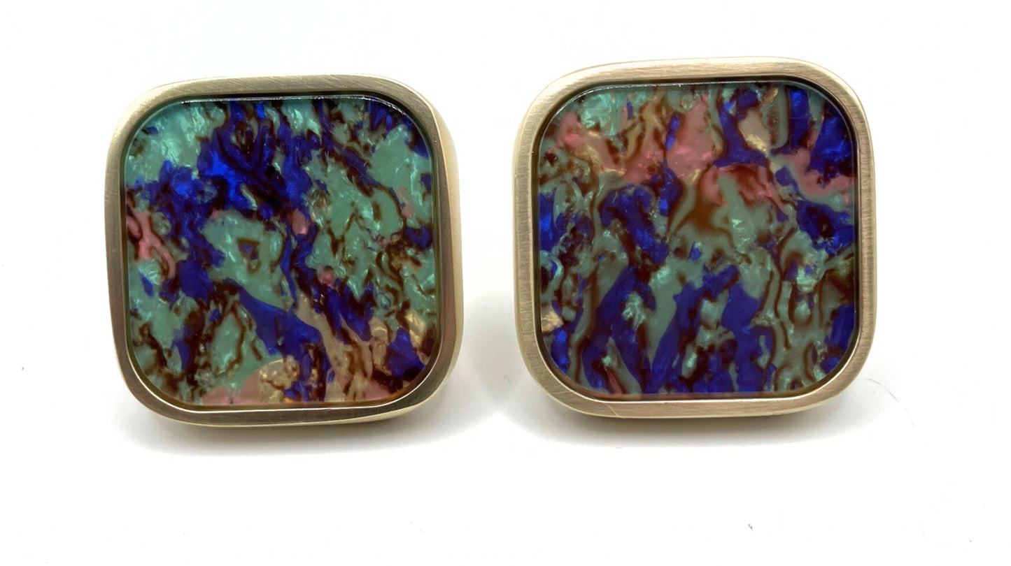 Square knobs with rounded corners showing the variation of colors and patterns between two of the same knob