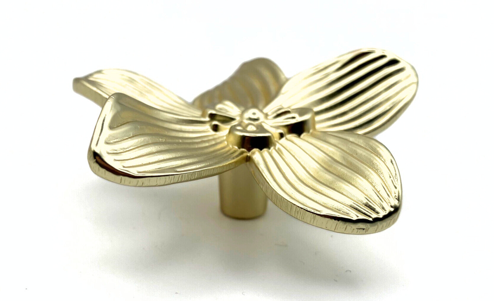 gold flower-shaped decorative knob on a white background