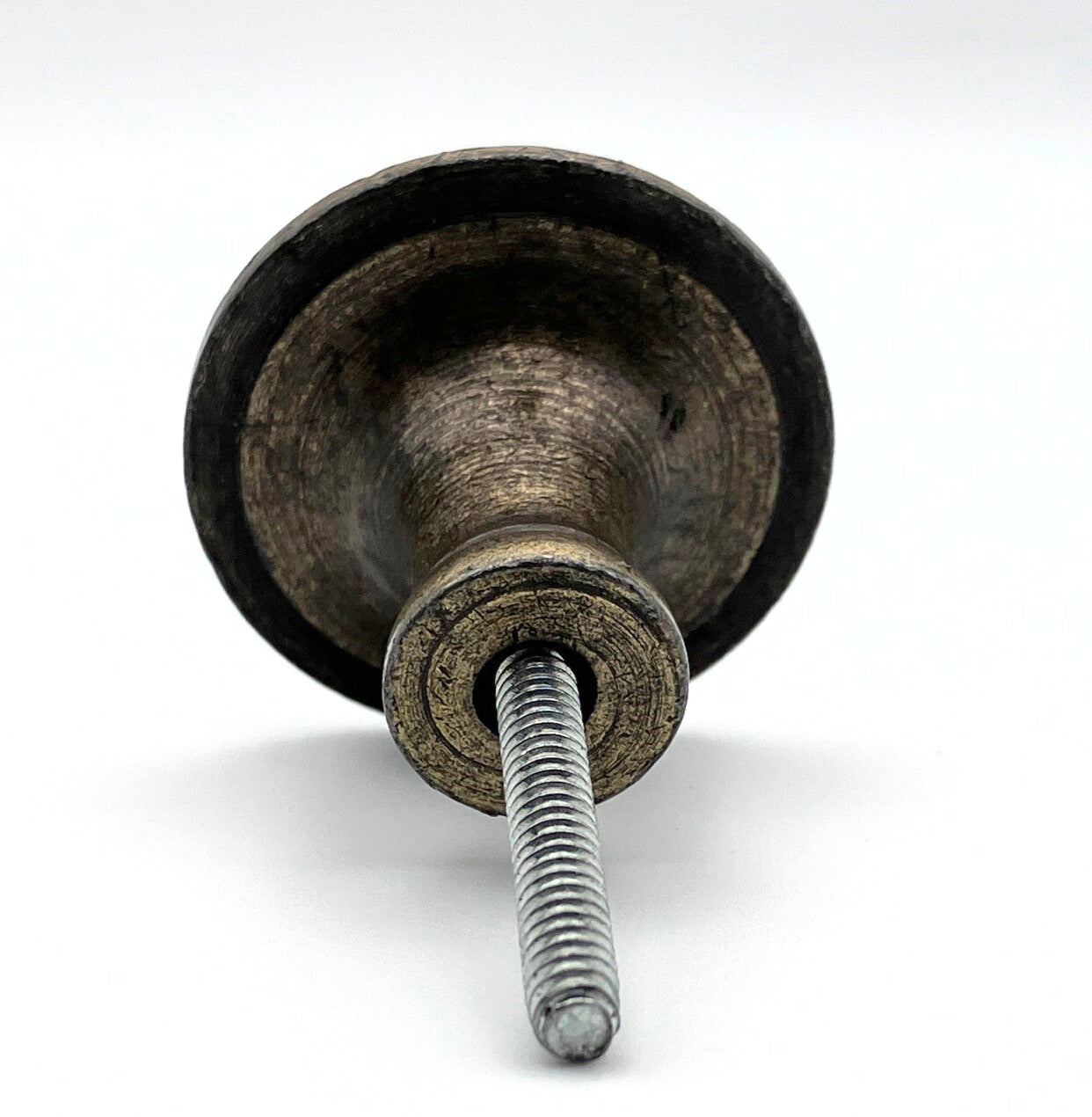 Metal knob with a bolt on a white background