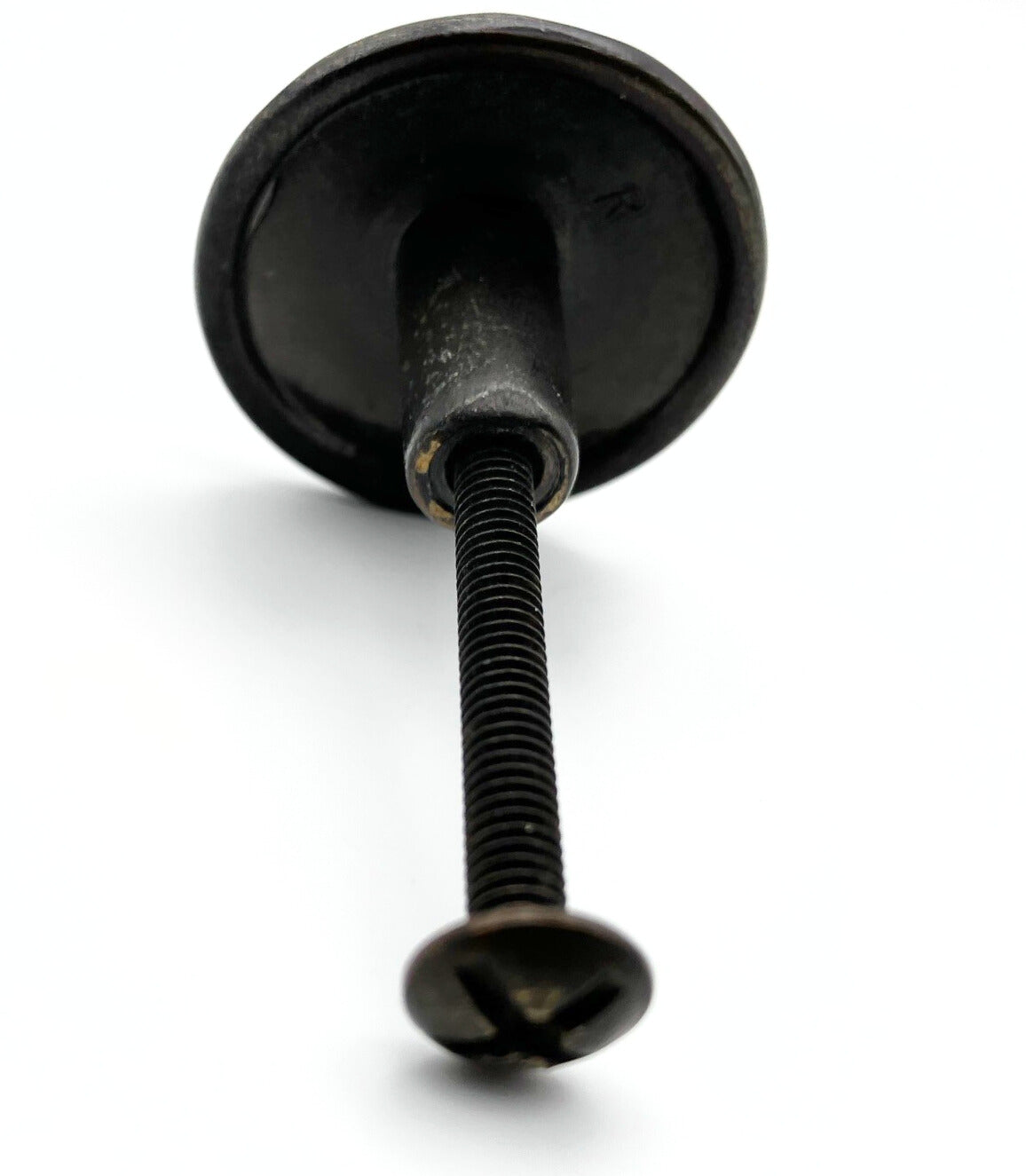 Black metal knob on a white background