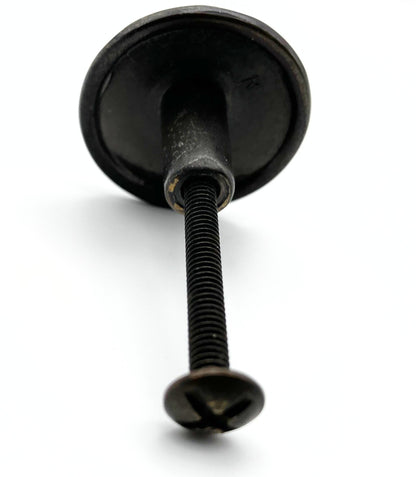 Black metal knob on a white background