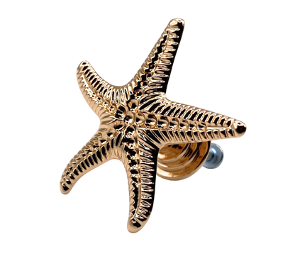 Gold starfish-shaped knob on a white background