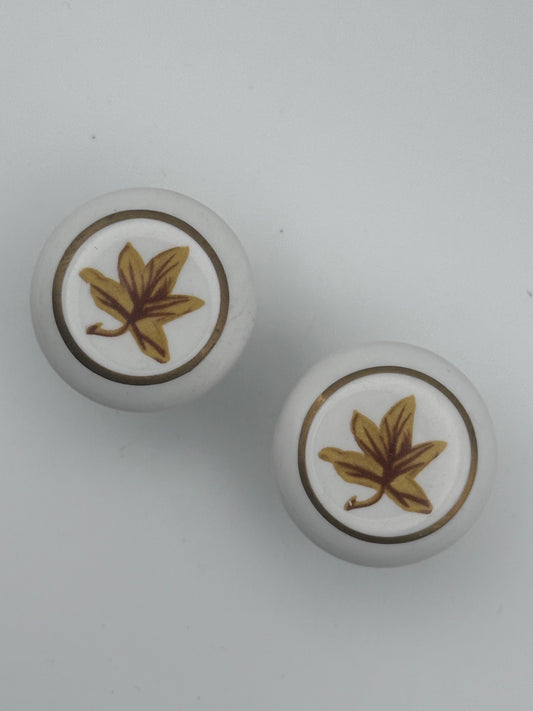 Set of two vintage 1980s maple leaf cabinet knobs with nature-inspired design and rustic charm