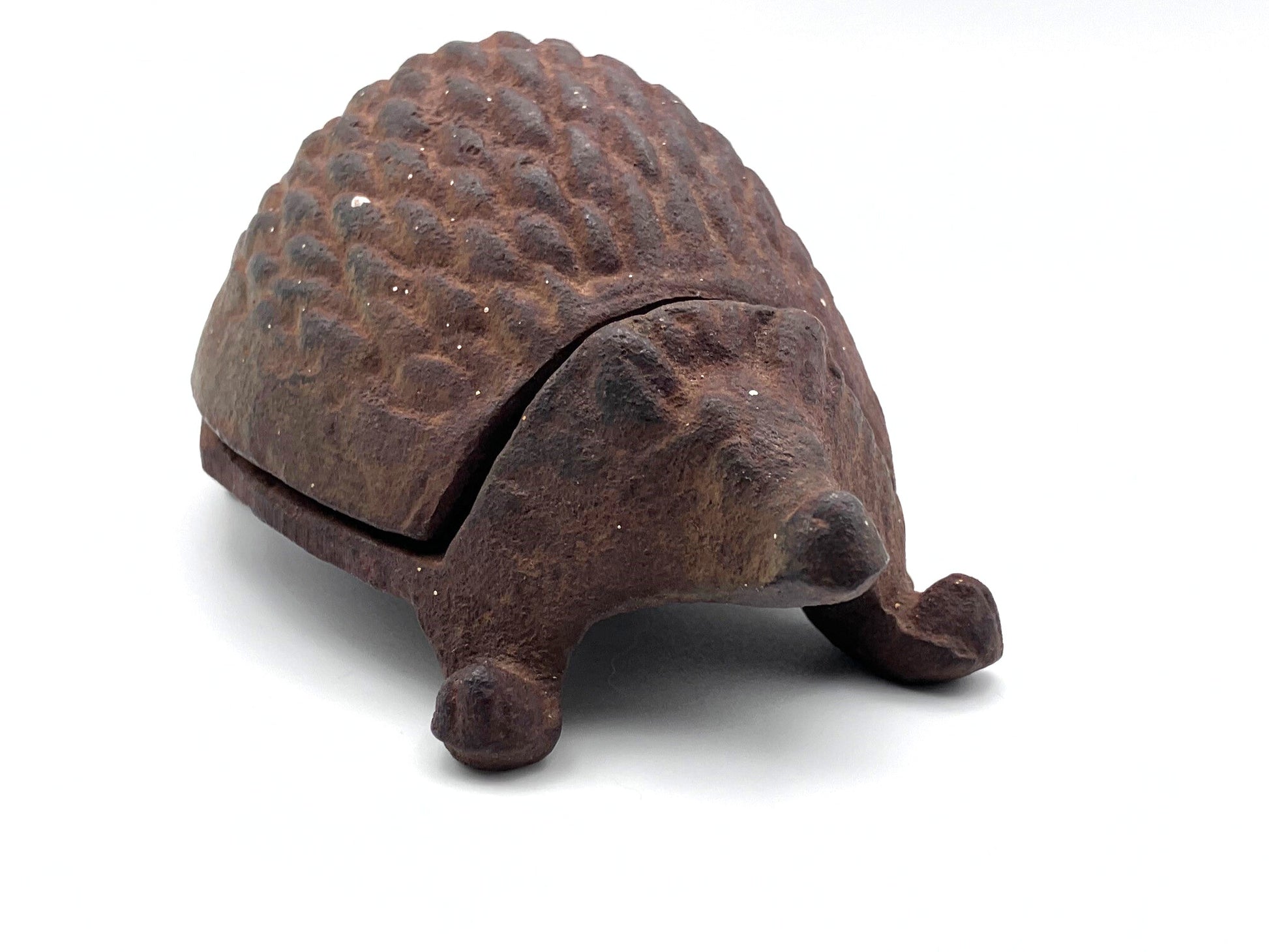 Decorative iron hedgehog on a white background