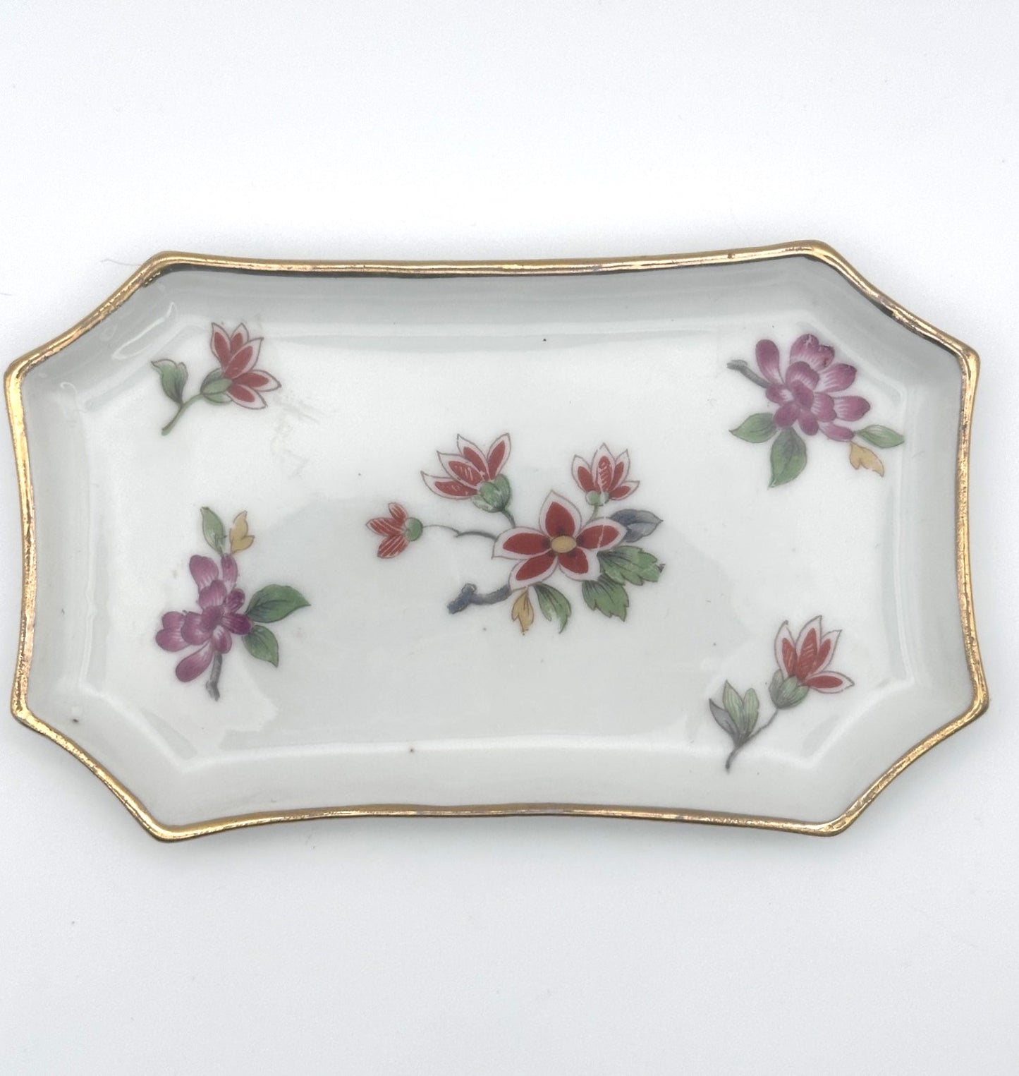 Vintage Limoges trinket tray collection featuring ornate designs and timeless French elegance