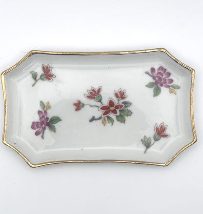 Vintage Limoges trinket tray collection featuring ornate designs and timeless French elegance