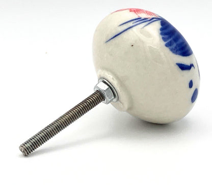 Ceramic knob with decorative design on a white background
