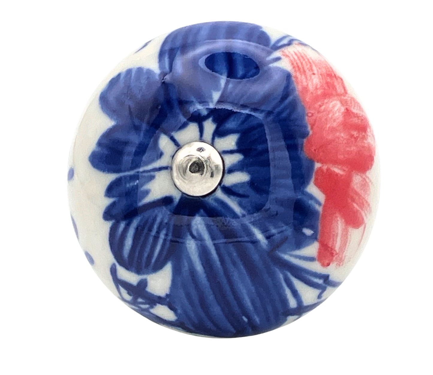 Decorative ceramic knob with blue floral design and red accents on a white background