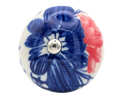 Decorative ceramic knob with blue floral design and red accents on a white background