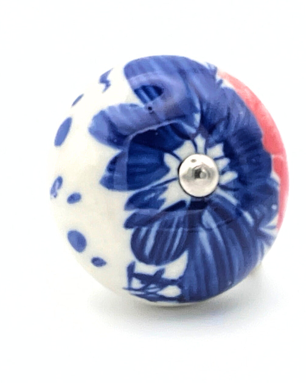 White ceramic knob with blue and red design on a white background