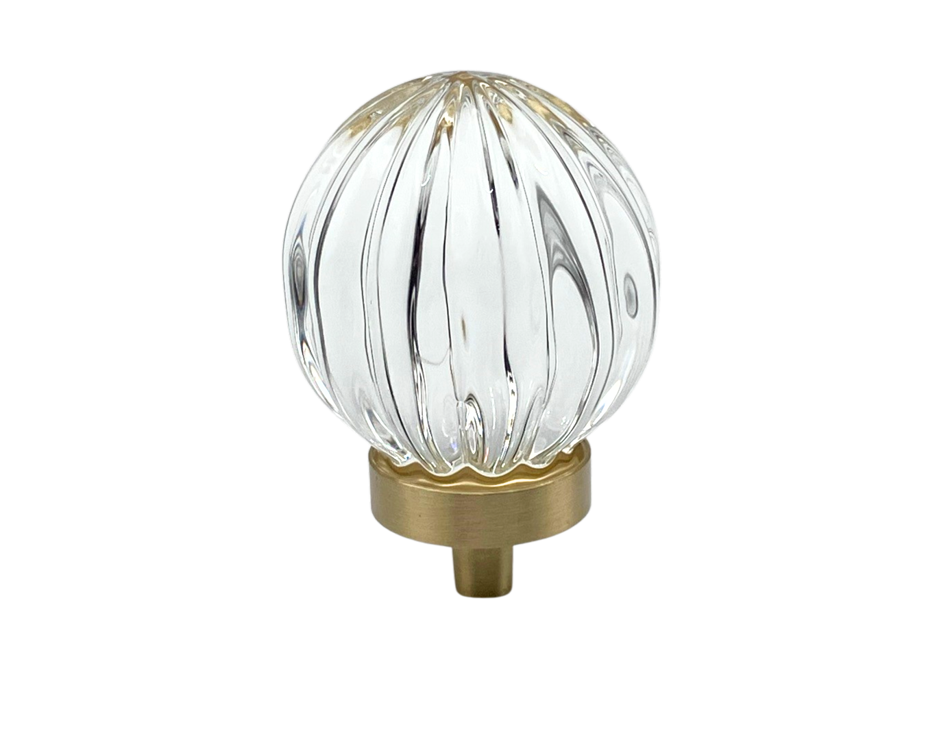 Clear glass ball with ribbed design and gold base on a white background