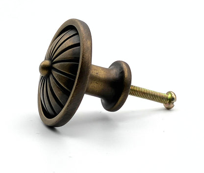 Bronze-colored cabinet knob on a white background