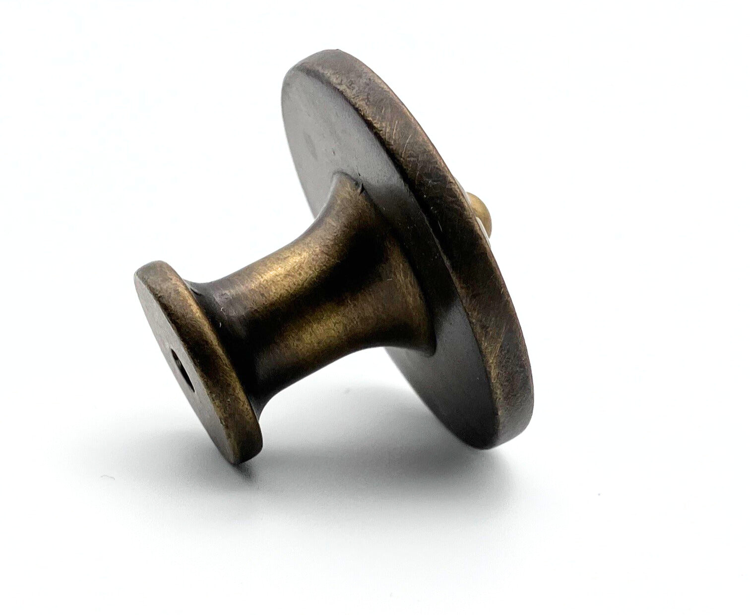 Bronze-colored knob on a white background