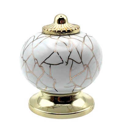 white round shaped knob with rose gold crackle design and gold metal hardware