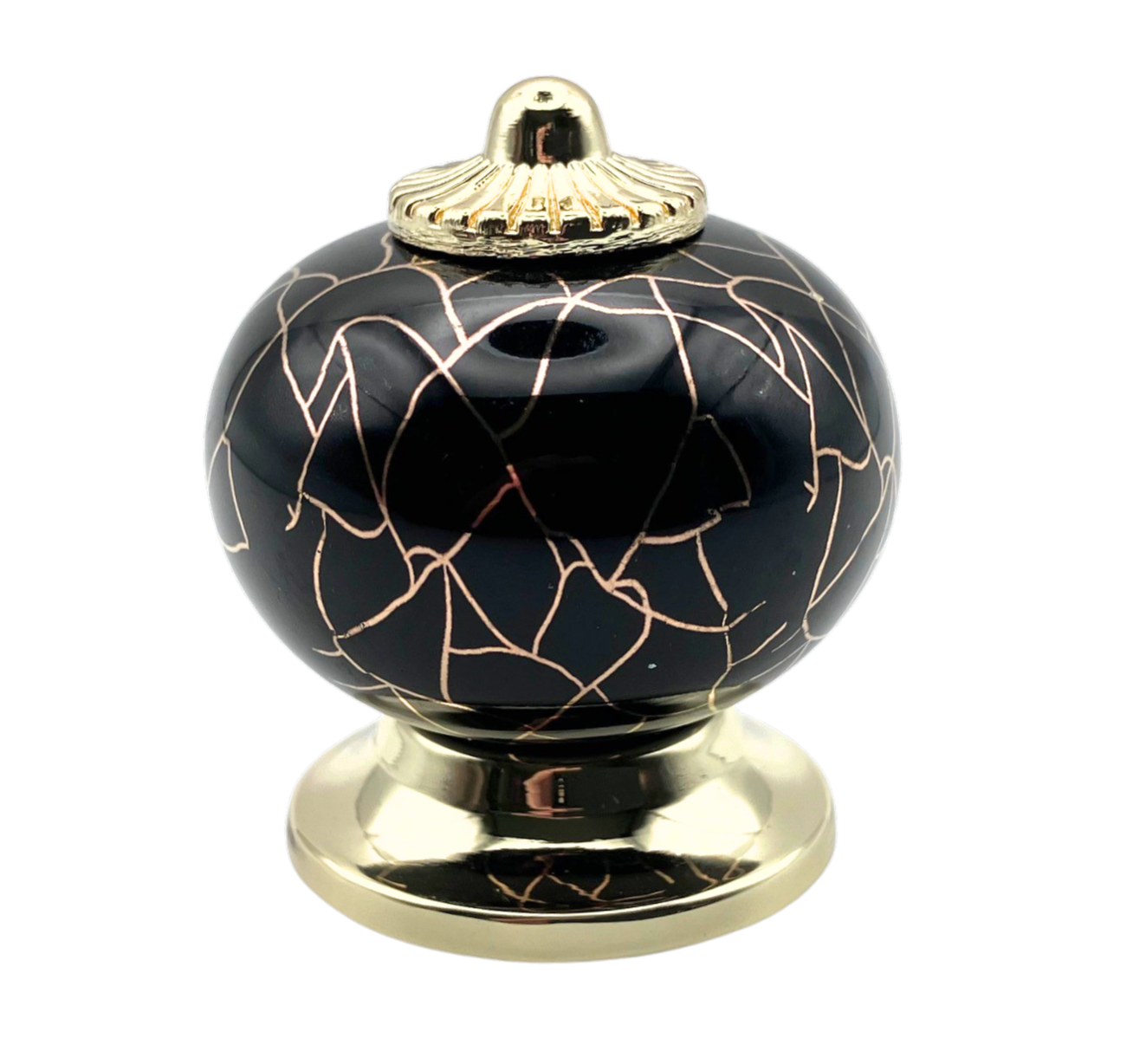 black round shaped knob with rose gold crackle design and gold metal hardware