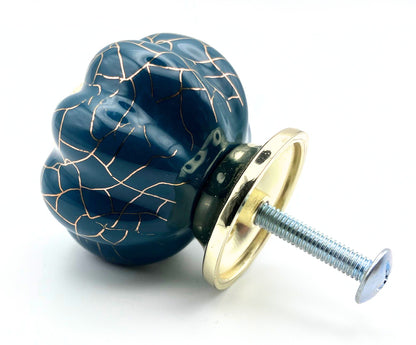 blue pumpkin shaped knob with rose gold crackle design and gold metal hardware