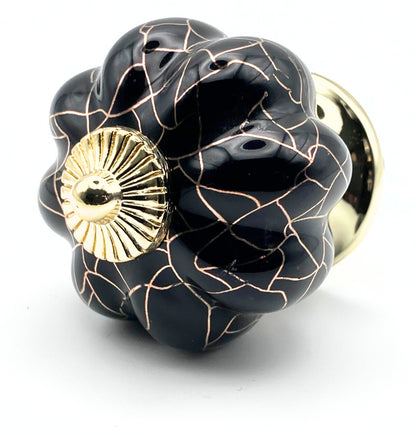 black pumpkin shaped knob with rose gold crackle design and gold metal hardware