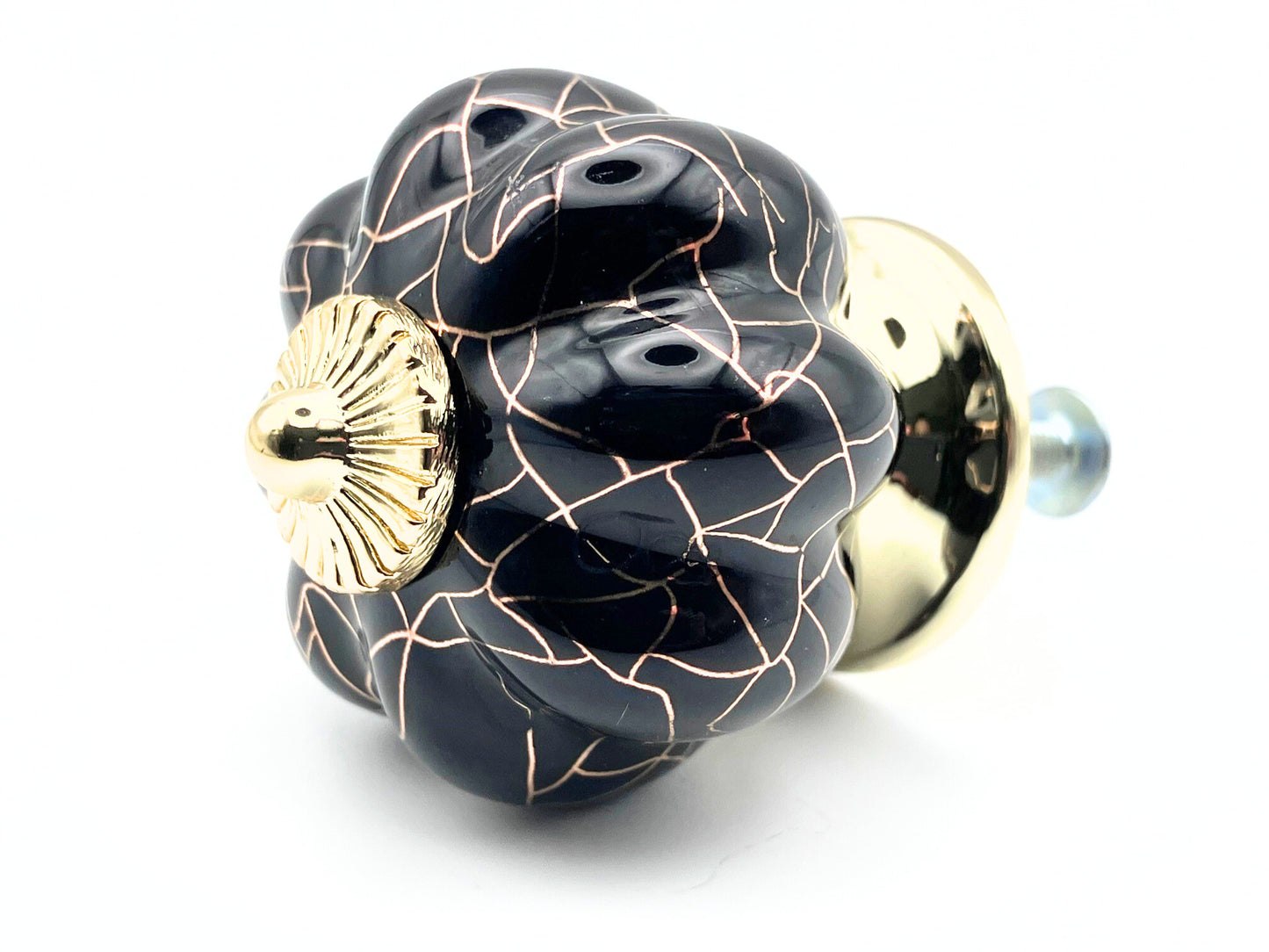 black pumpkin shaped knob with rose gold crackle design and gold metal hardware