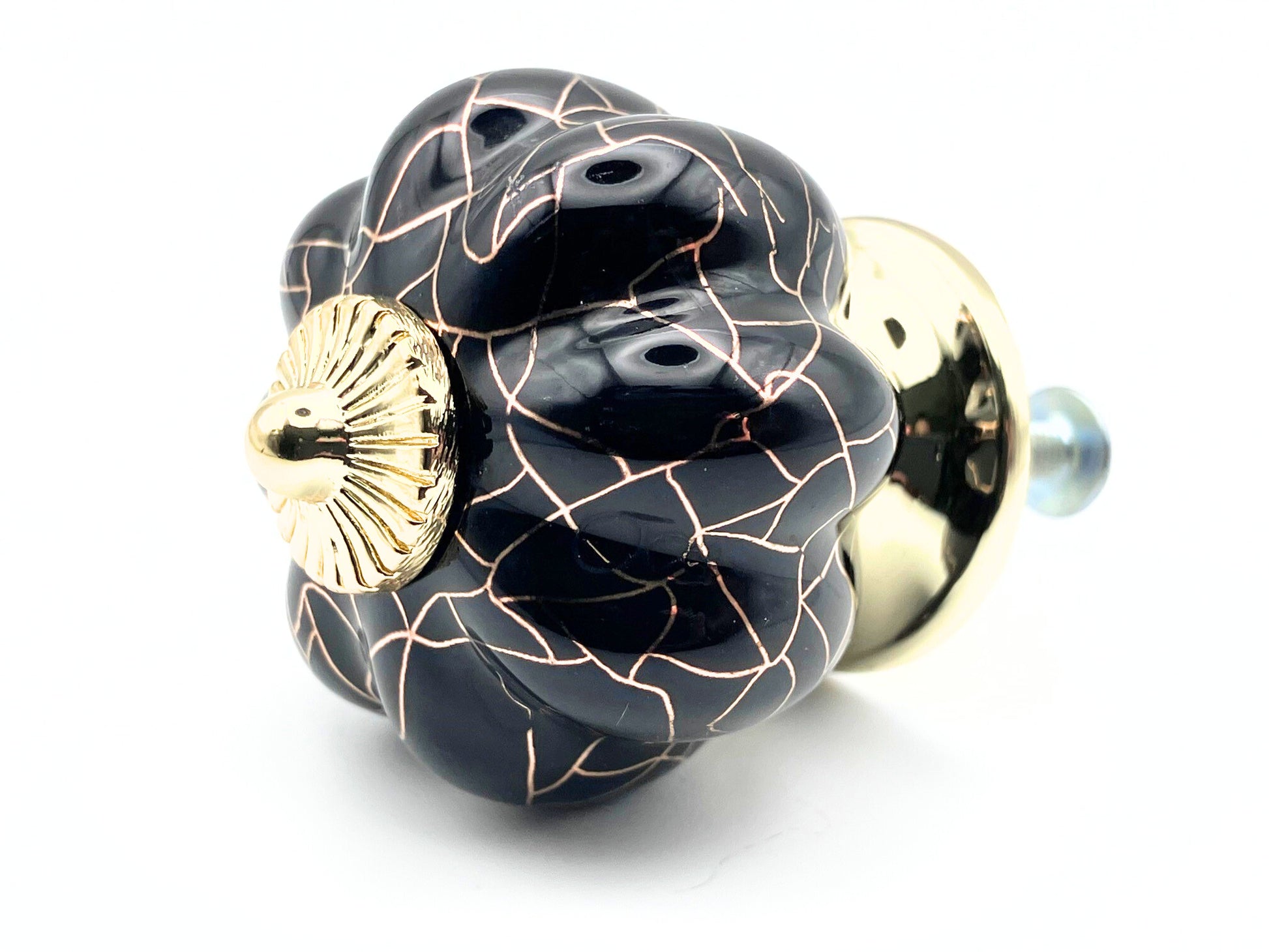 black pumpkin shaped knob with rose gold crackle design and gold metal hardware
