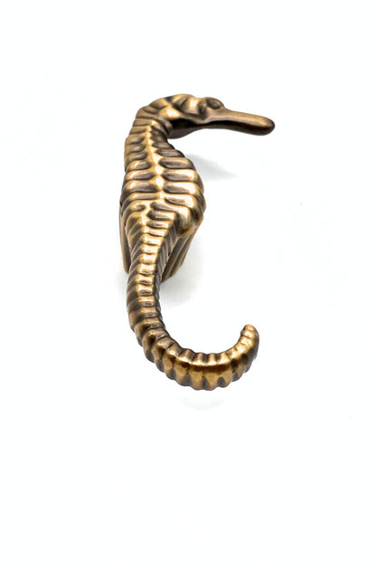 Bronze seahorse knob on a white background