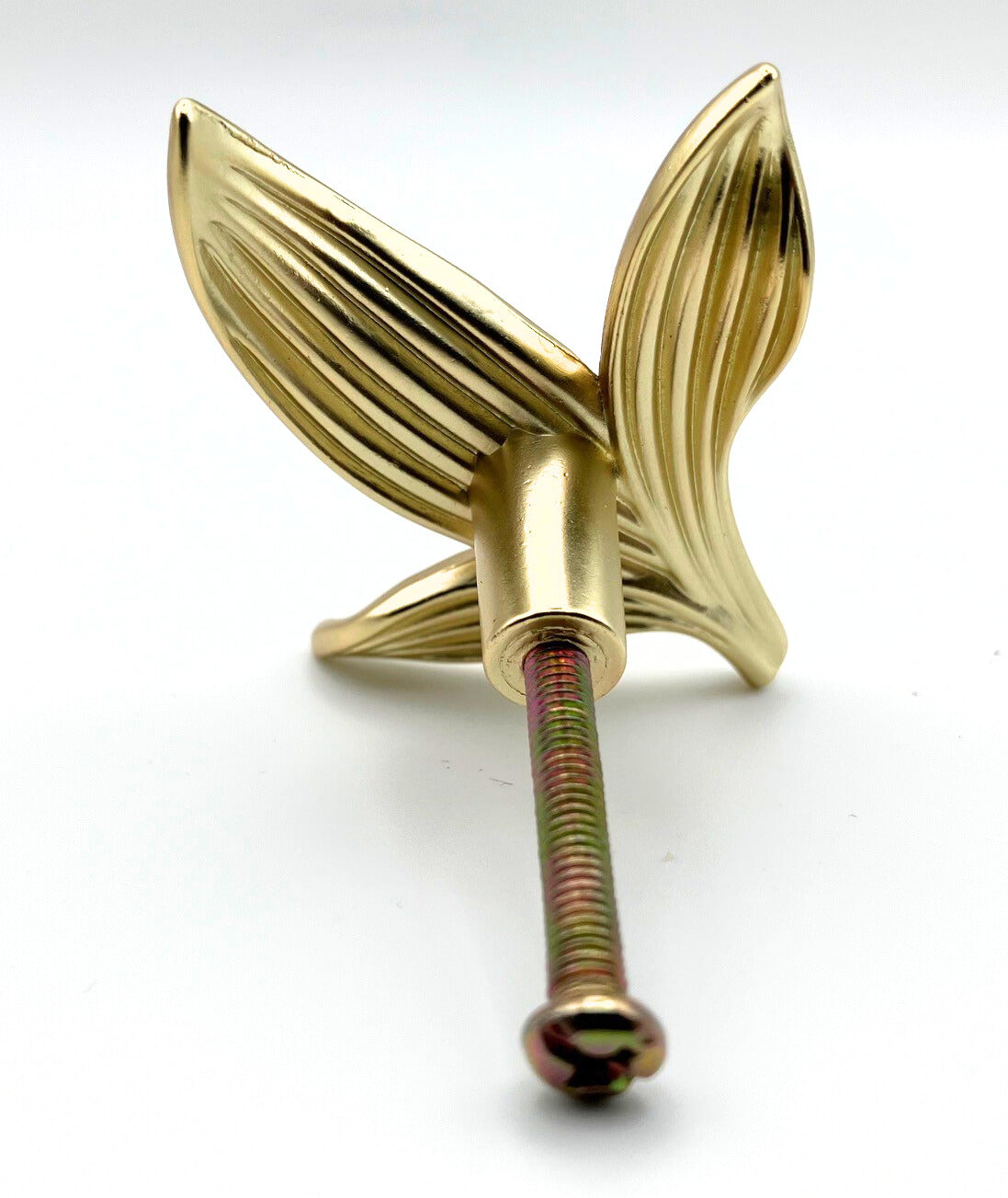 Gold leaf-shaped knob on a white background