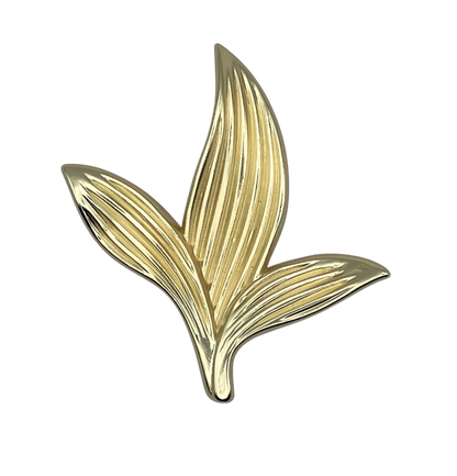 Gold leaf-shaped knob on a white background