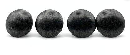 Four black knobs objects on a white background