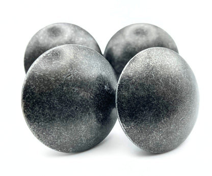 Four metallic knobs on a white background