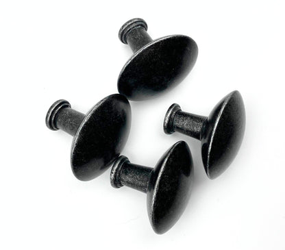 Four black metal cabinet knobs on a white background