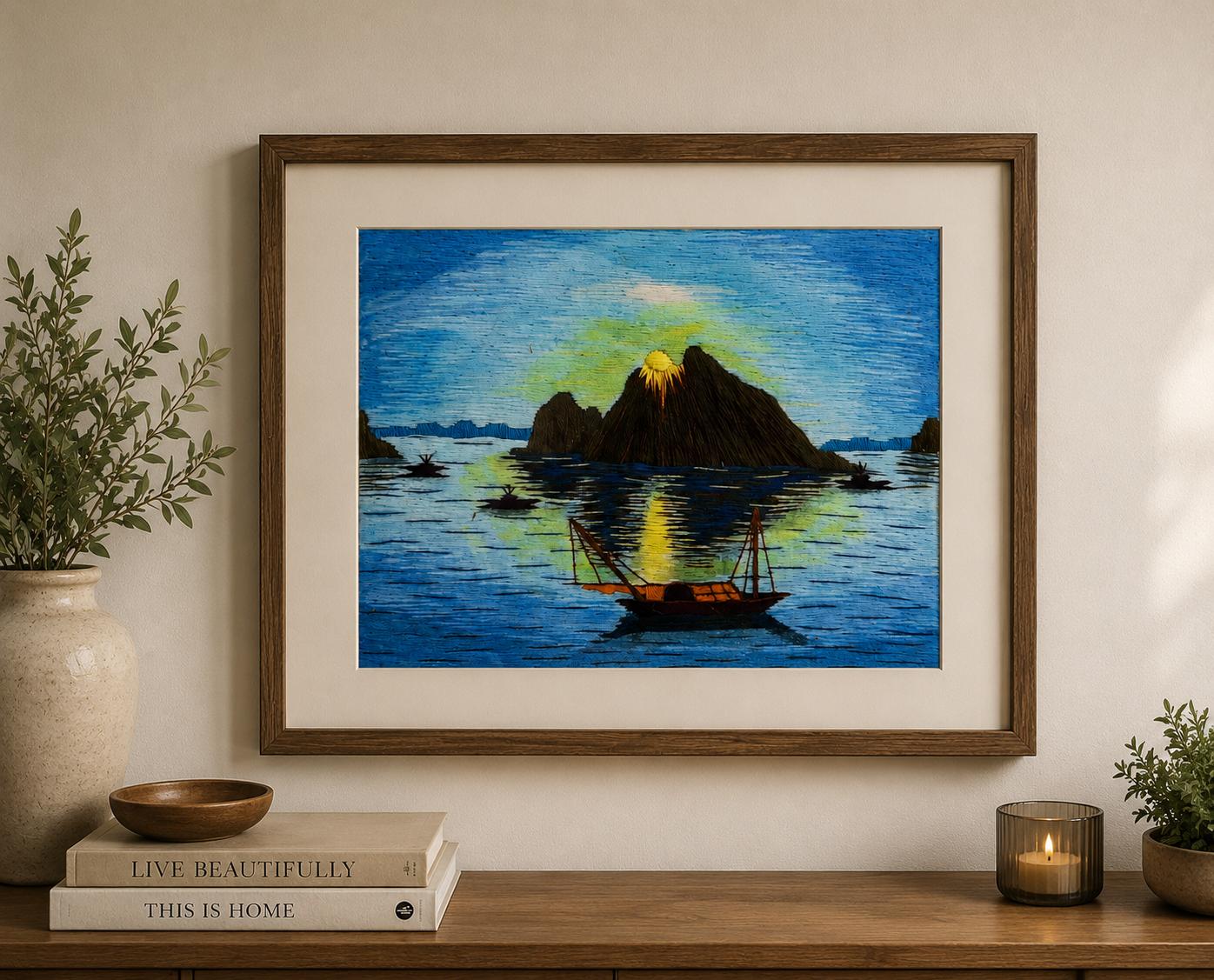 Vintage thread art landscape framed and showcased above a console table in a traditional home interior.