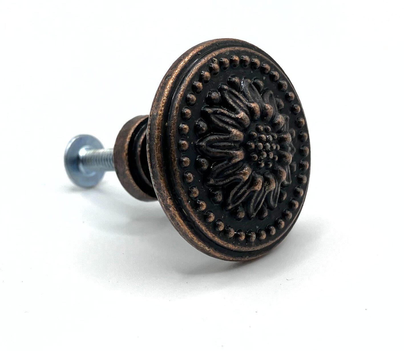 Decorative cabinet knob with floral design on a white background