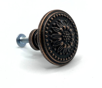 Decorative cabinet knob with floral design on a white background