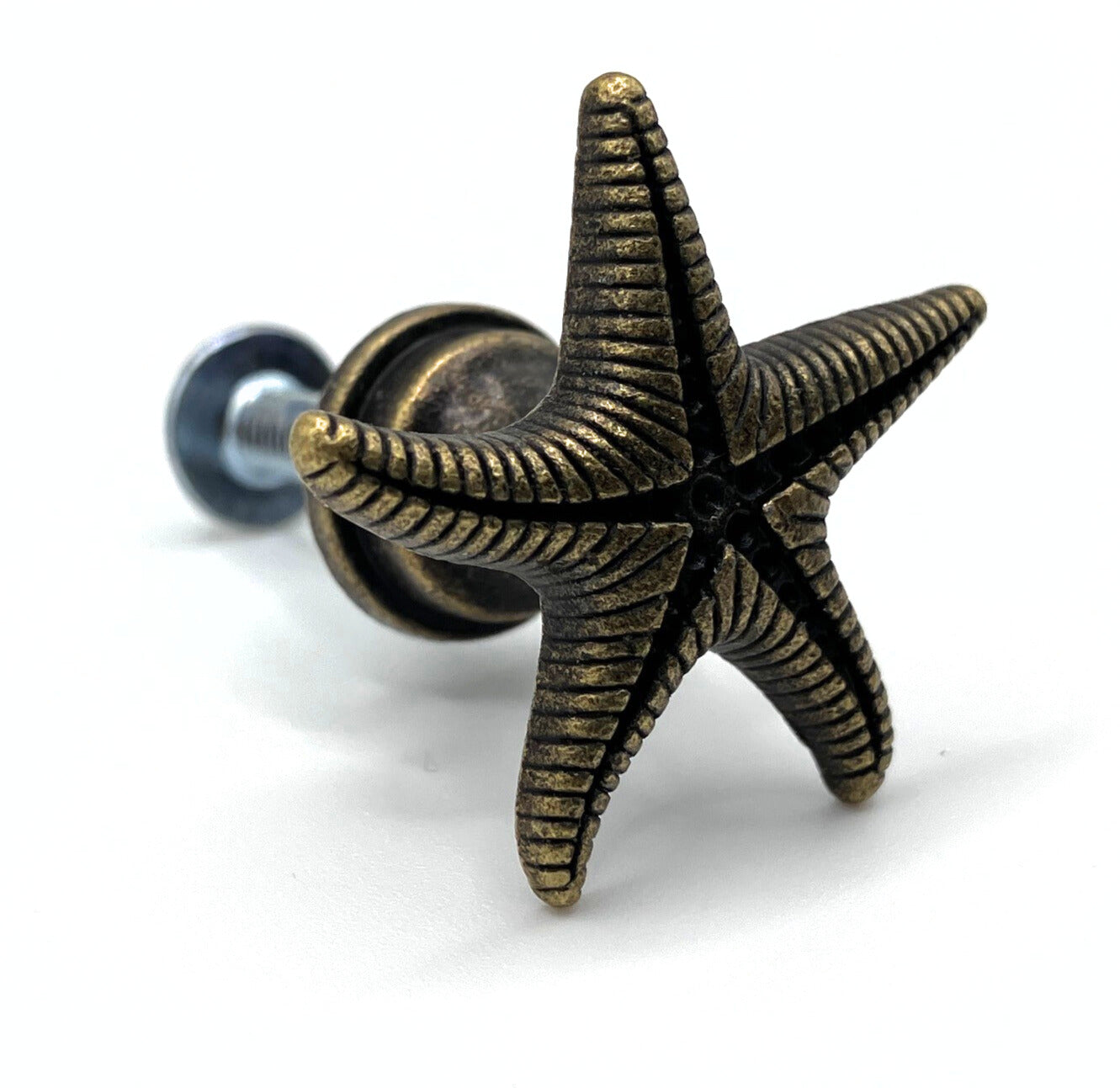 Bronze star-shaped knob on a white background