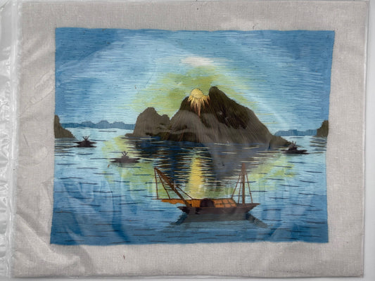 Artistic depiction of a mountain and boats on water with a starry sky.