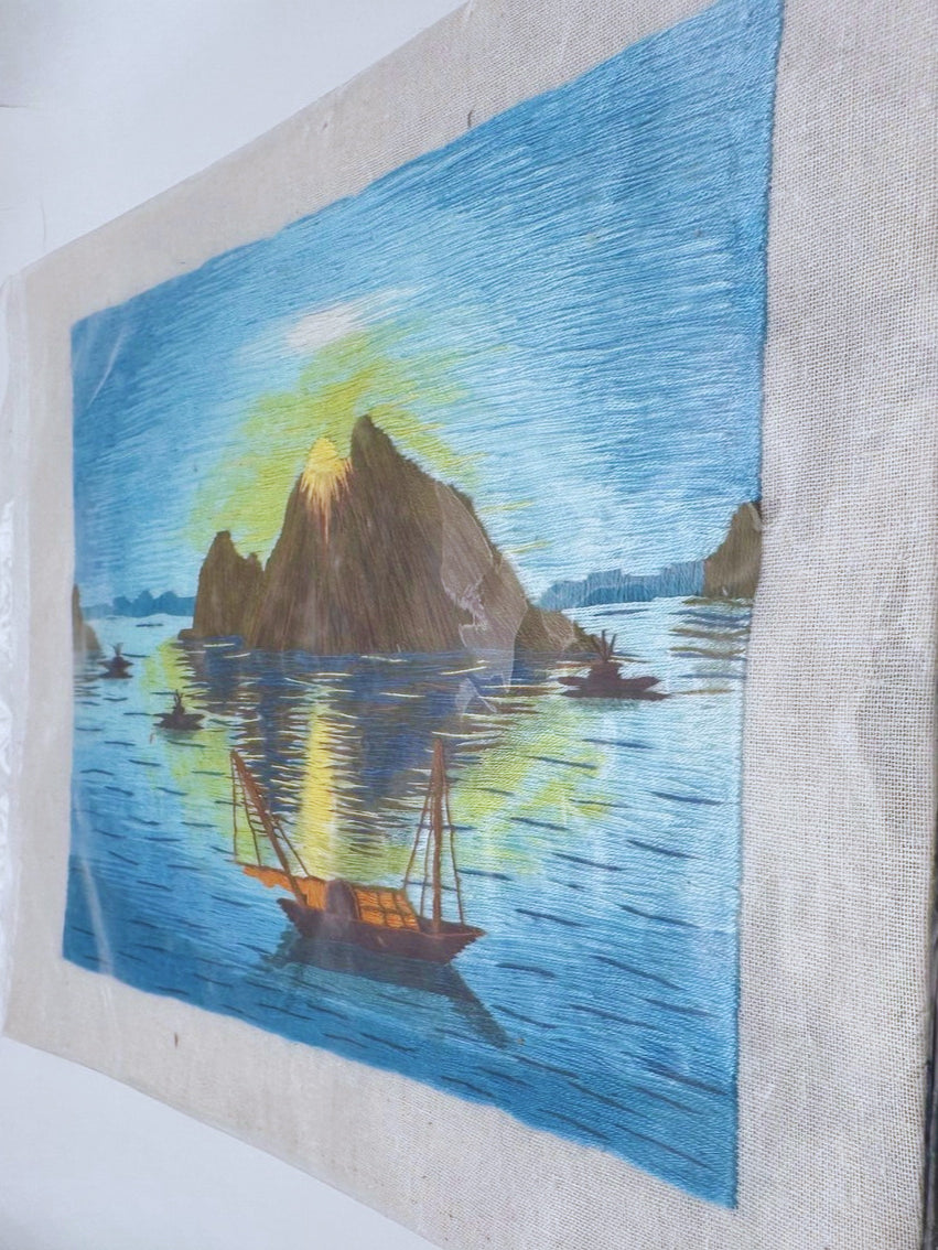 Handmade Southeast Asian silk thread art from the 1970s with blue embroidered details and cultural influence