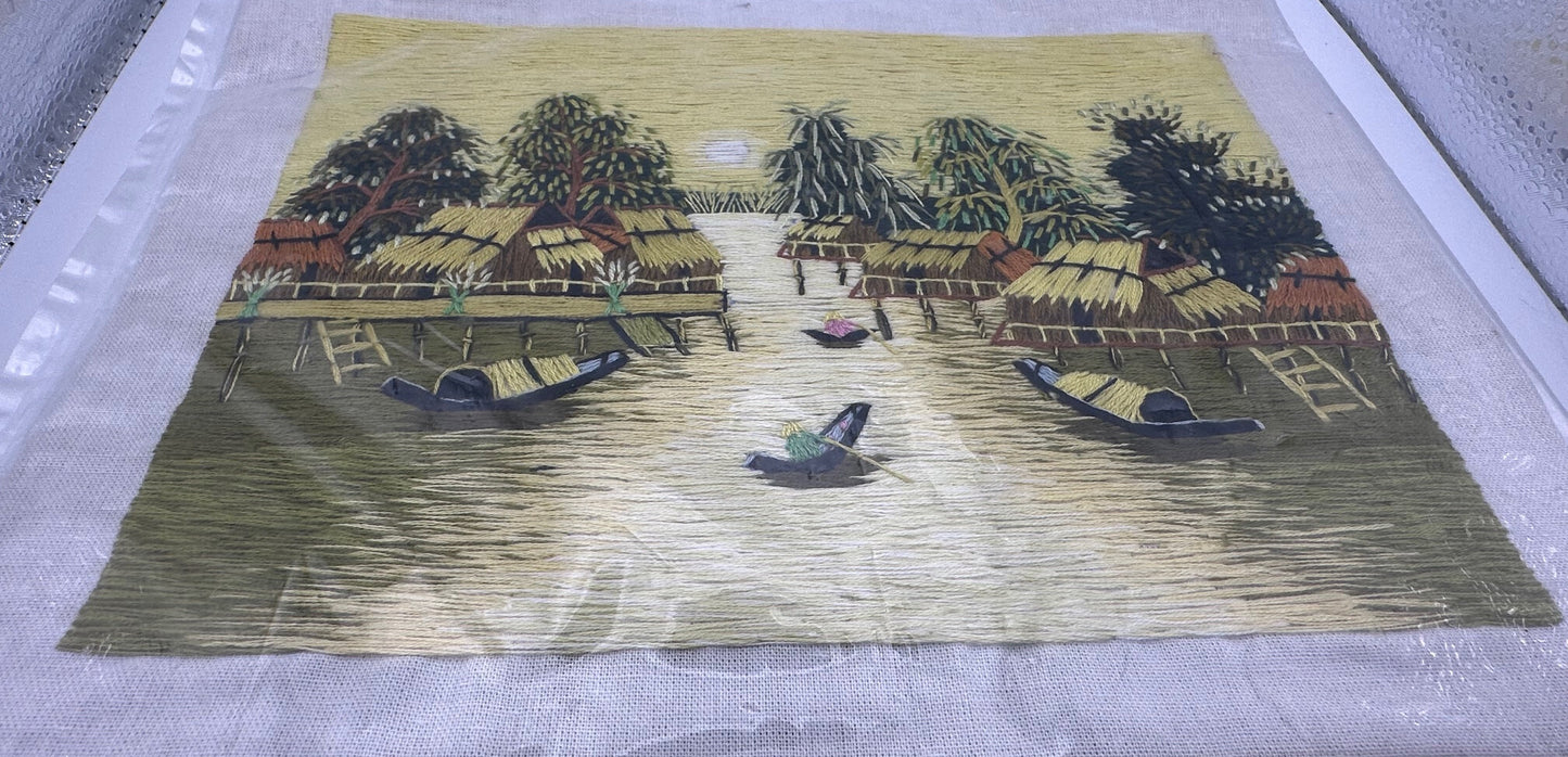 Vintage Southeast Asian textile artwork with yellow silk thread design and handcrafted cultural details